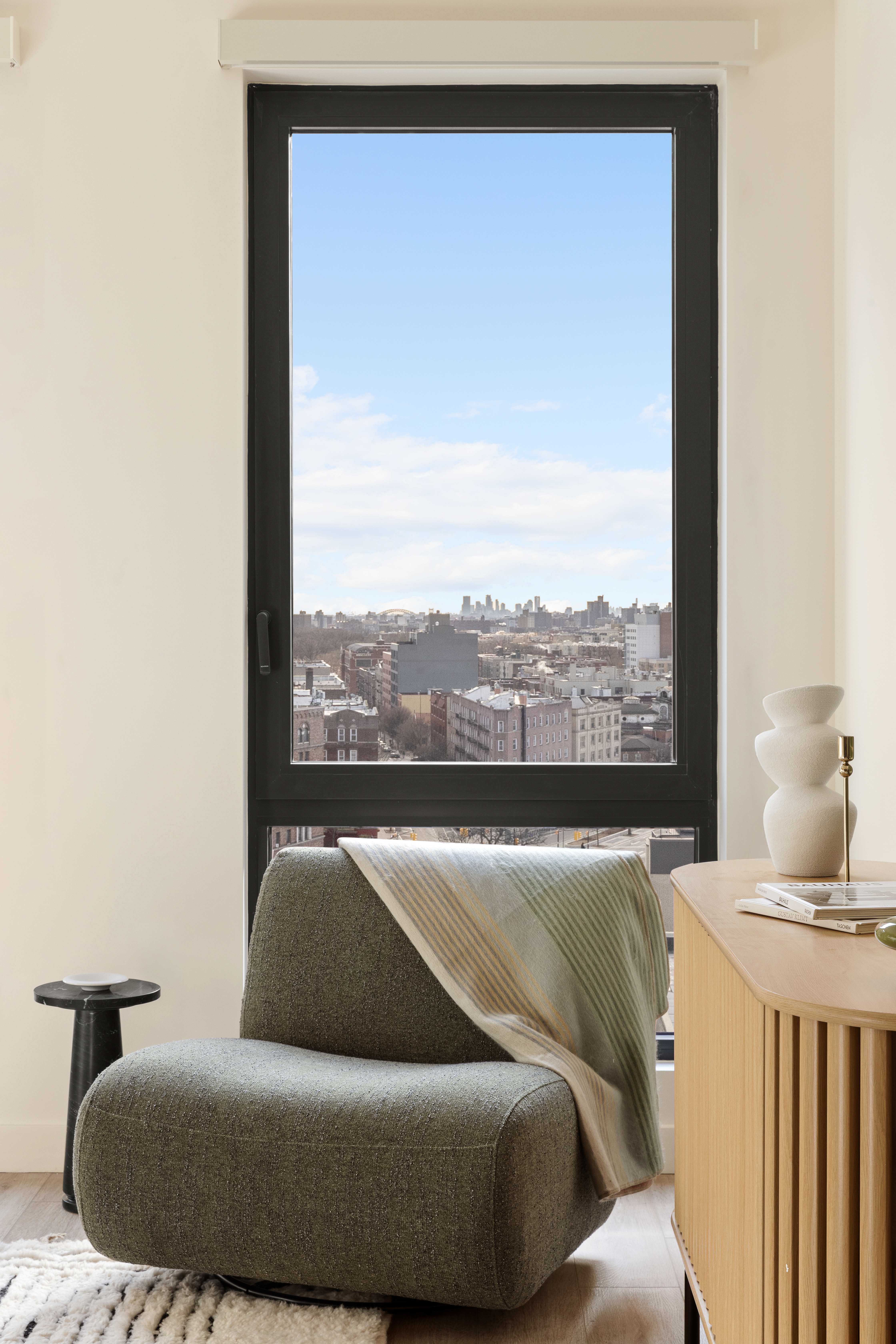 130 East 177th Street, Unit 11F Bronx, NY 10453 - Photo 3 of 18 a living room with couch and a large window