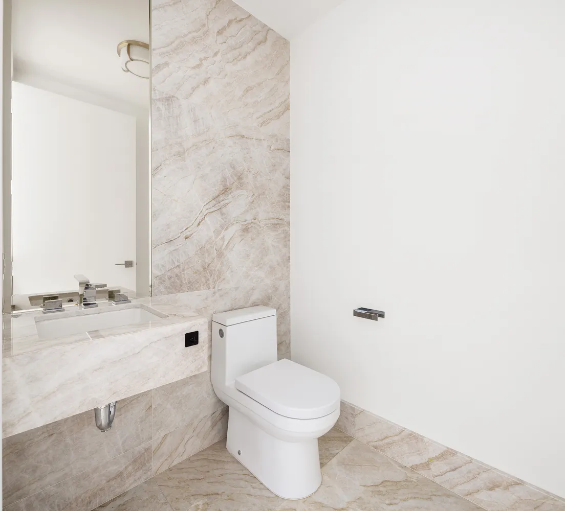 a bathroom with a toilet a sink and a bathtub