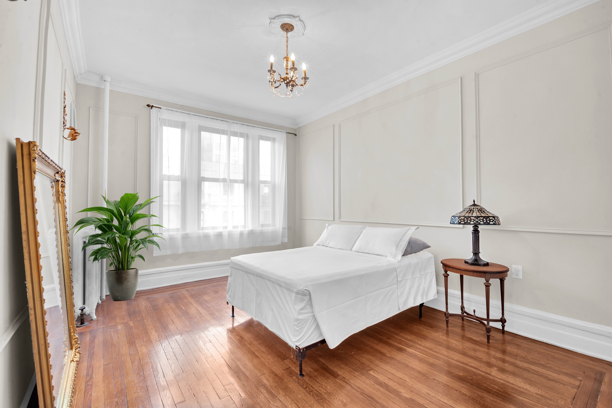 47 Fort Washington Avenue, Unit 55 Manhattan, NY 10032 - Photo 6 of 20 a spacious bedroom with a bed and a window