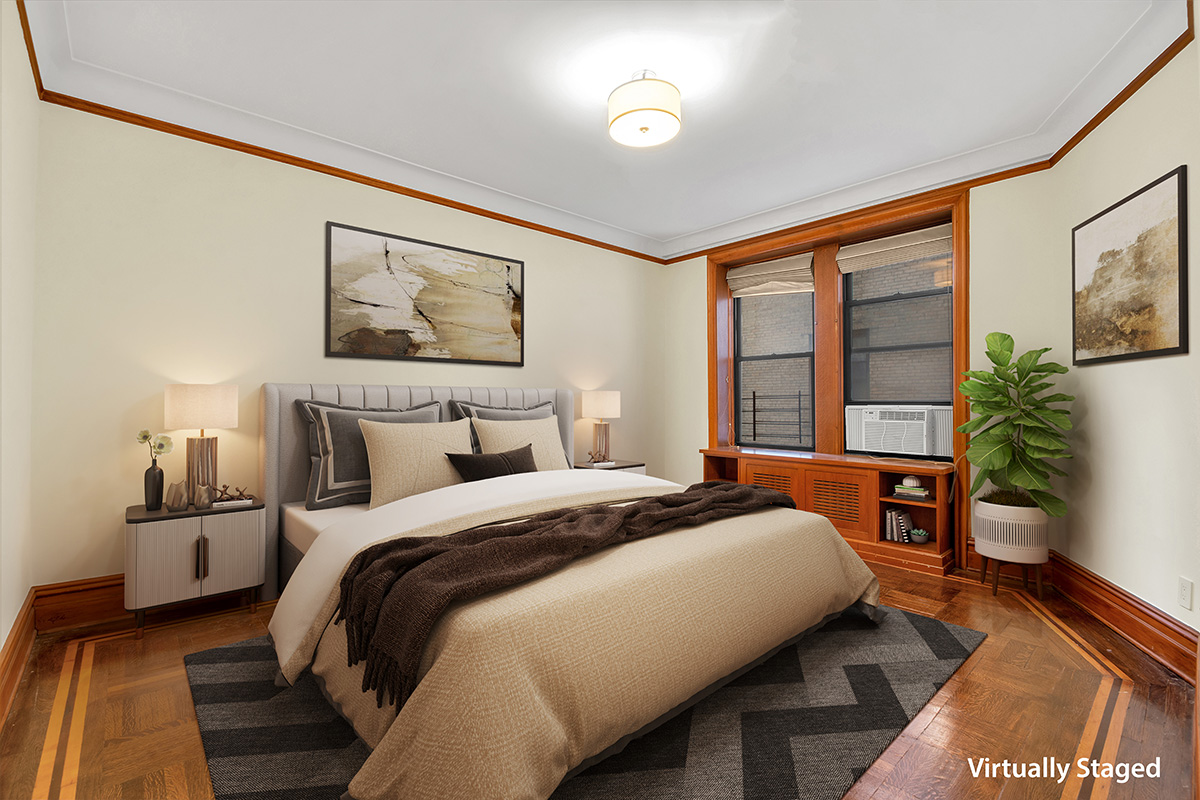 790 Riverside Drive, Unit 5F Manhattan, NY 10032 - Photo 5 of 12 a bedroom with a large bed and a potted plant