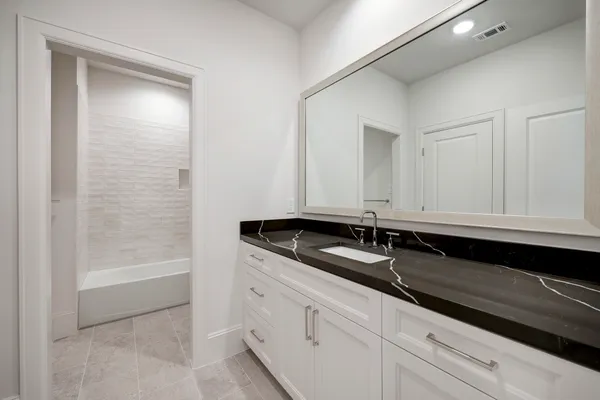 a bathroom with a sink and a bathtub