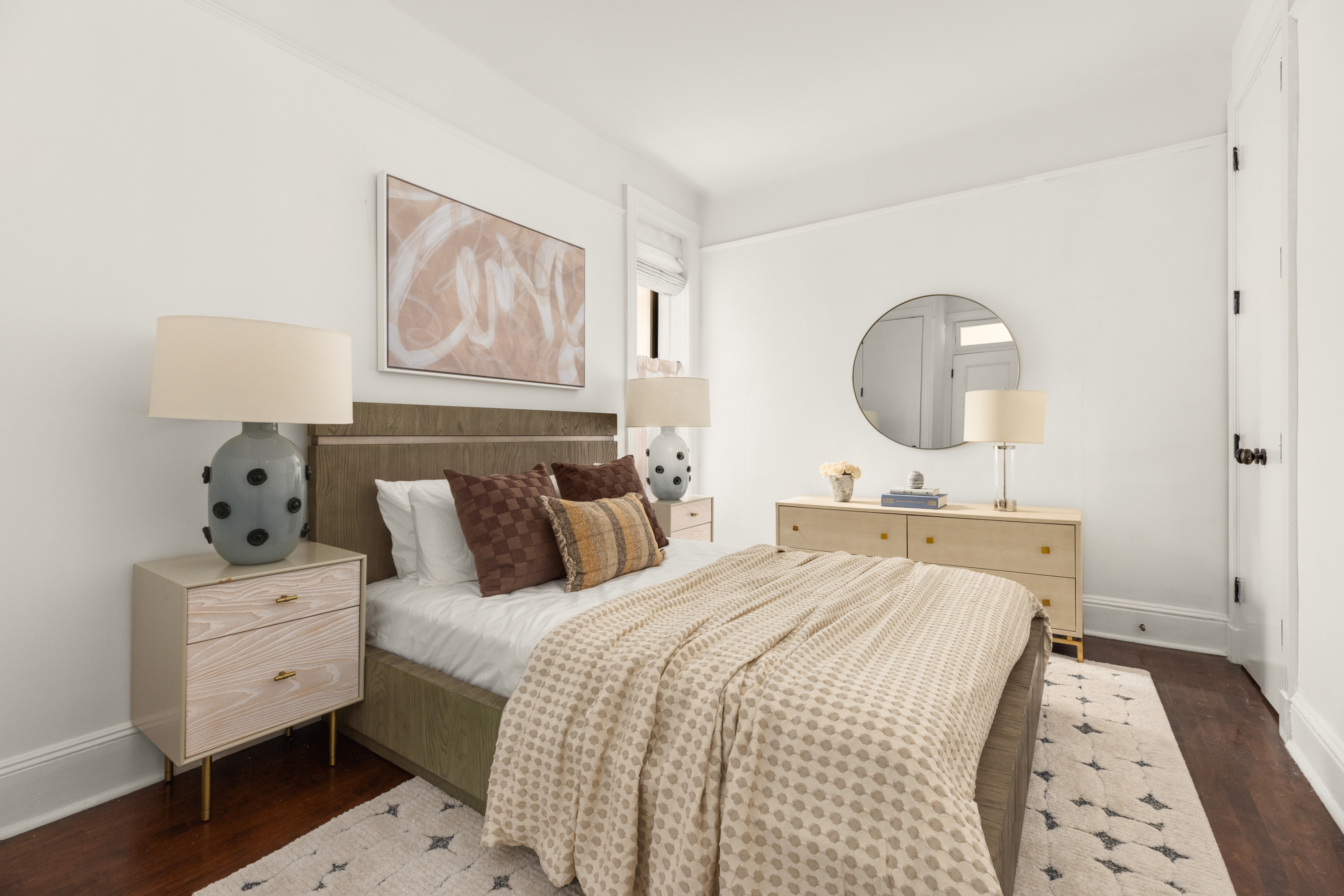 126 East 12th Street, Unit 2C Manhattan, NY 10003 - Photo 5 of 10 a bedroom with a bed and a lamp