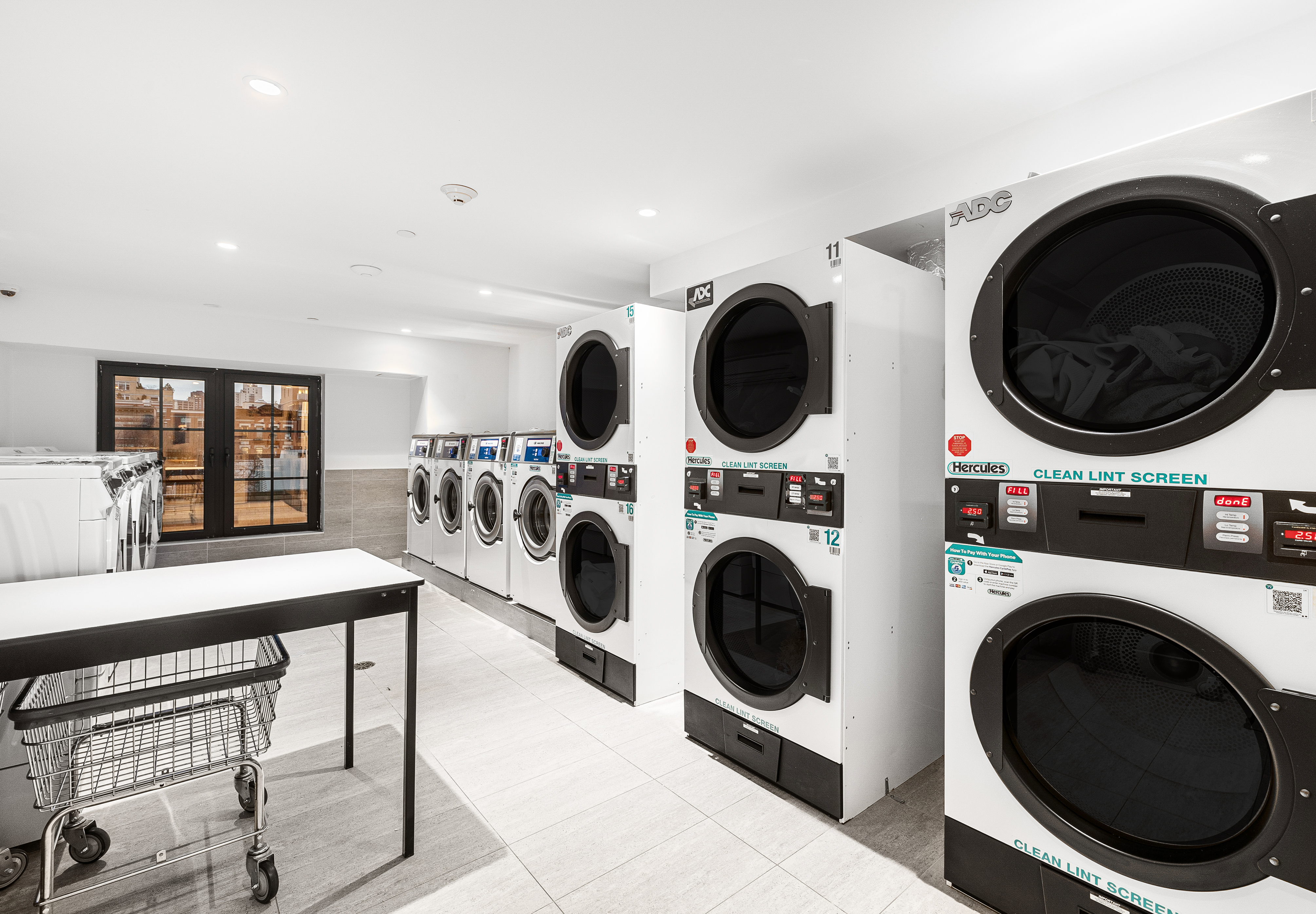 300 West 122nd Street, Unit 4F Manhattan, NY 10027 - Photo 23 of 32 a view of a kitchen with a washer and dryer