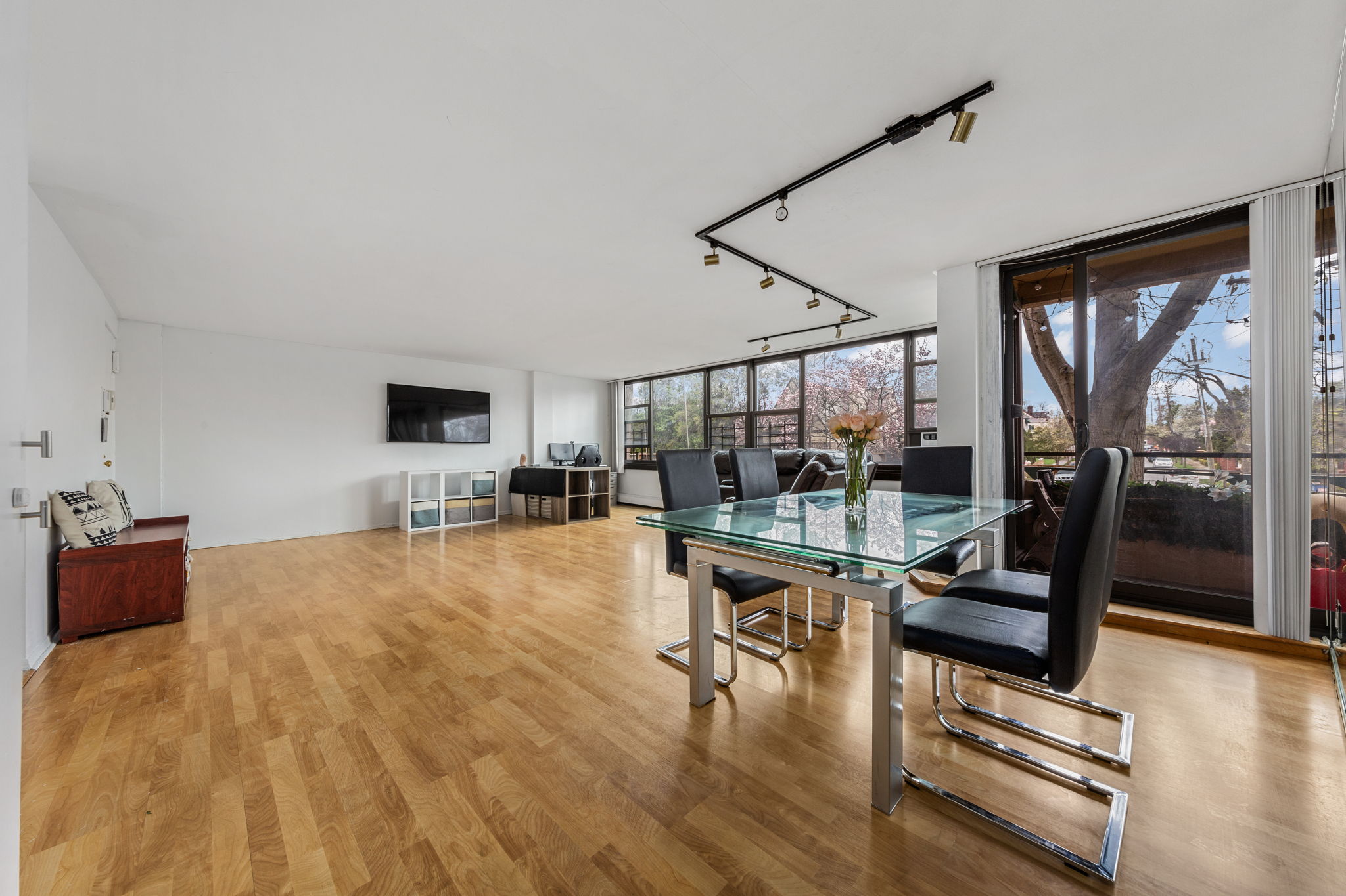 11-01 162nd Street, Unit 3D Queens, NY 11357 - Photo 2 of 16 a living room with furniture and floor to ceiling window