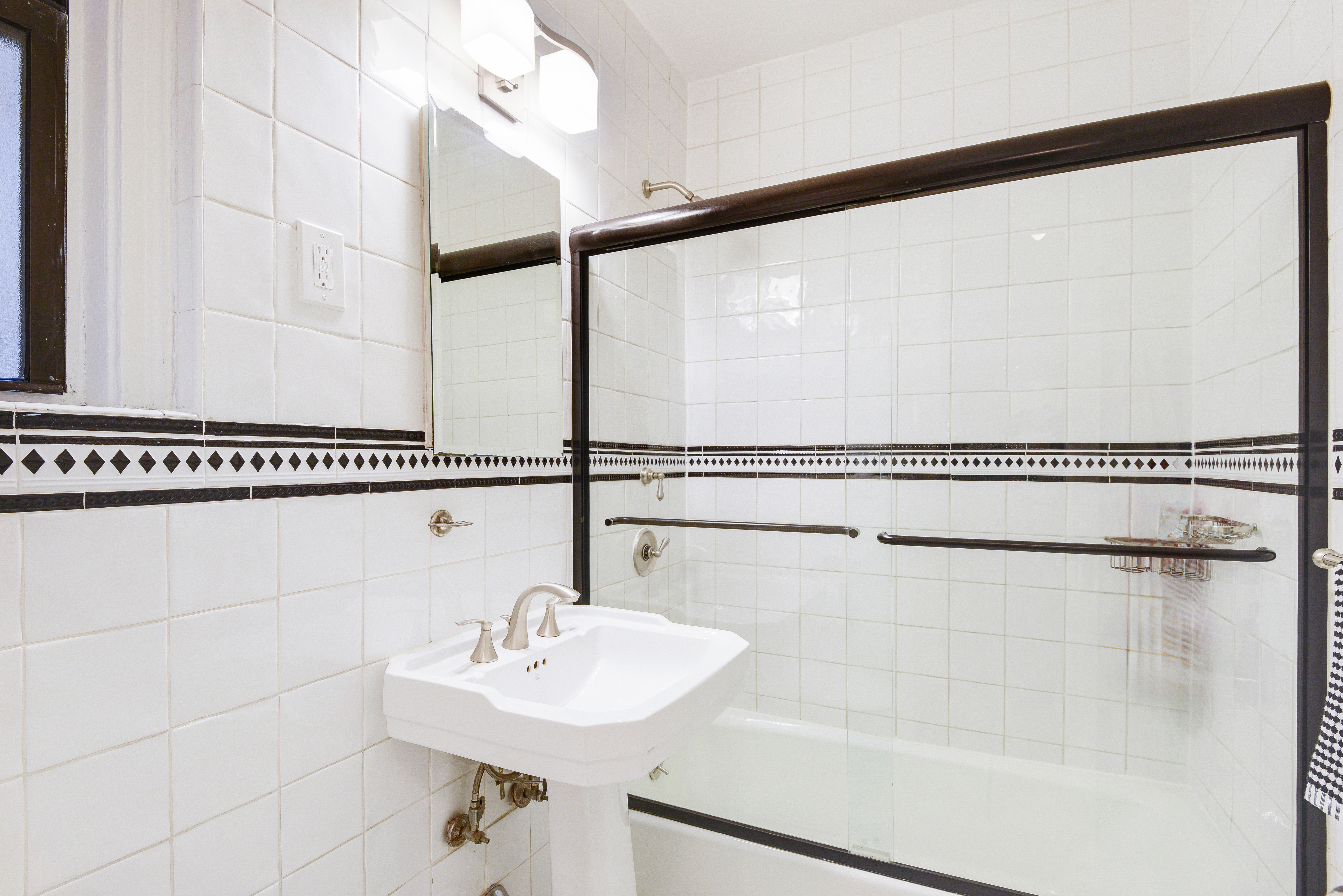 321 West 90th Street, Unit 2F/3F Manhattan, NY 10024 - Photo 9 of 15 a bathroom with a sink and a mirror