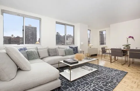 a living room with furniture and a rug