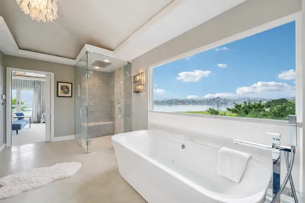 a bathroom with a bathtub and a shower