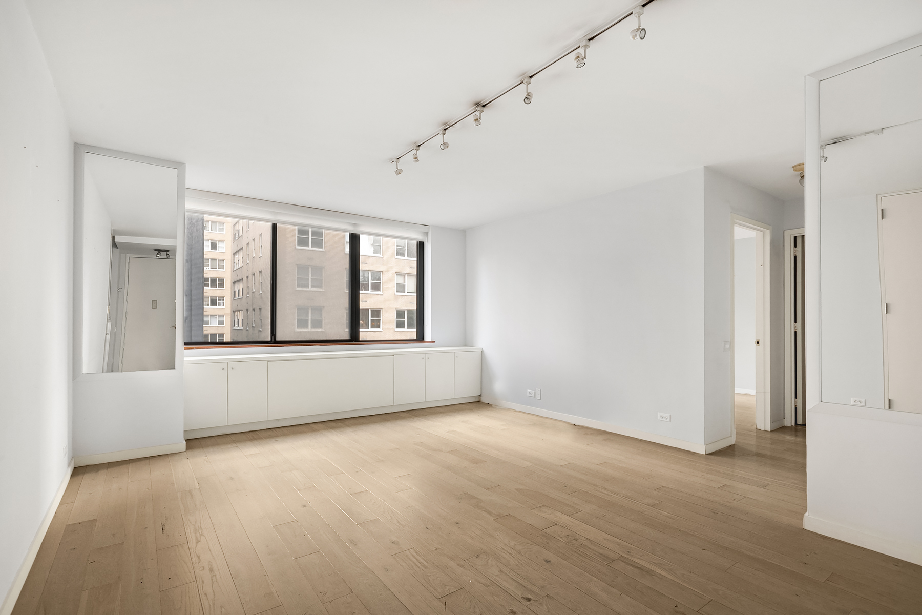 330 East 75th Street, Unit 3L Manhattan, NY 10021 - Photo 10 of 14 a view of an empty room with a window