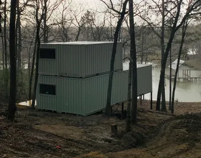 a view of a room with wooden floor and windows