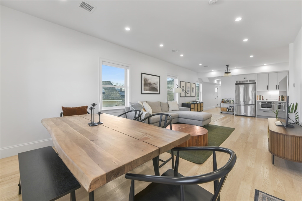 17 Akron Street, Unit 2 Boston, MA 02119 - Photo 8 of 26 a dining room with furniture and wooden floor
