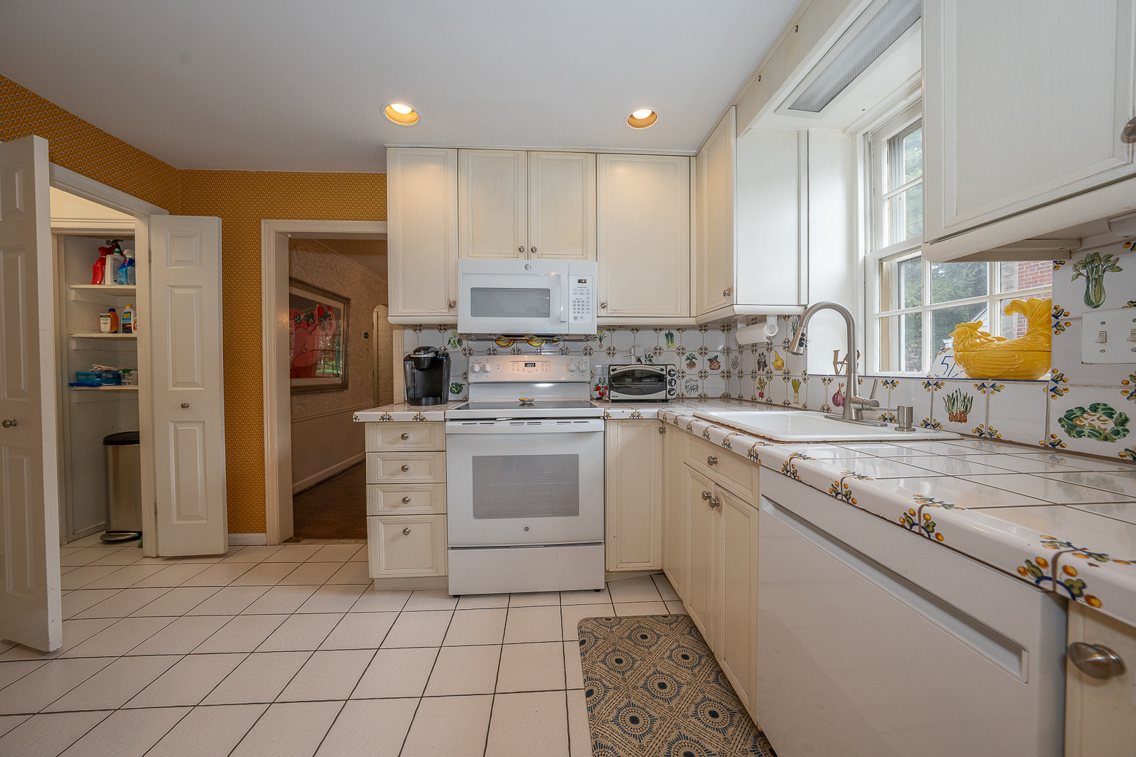 519 Mercer Road Merion Station, PA 19066 - Photo 15 of 58 a kitchen with a stove a sink and a refrigerator