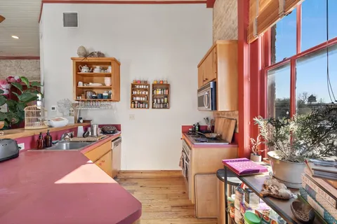 a living room with furniture window and wooden floor