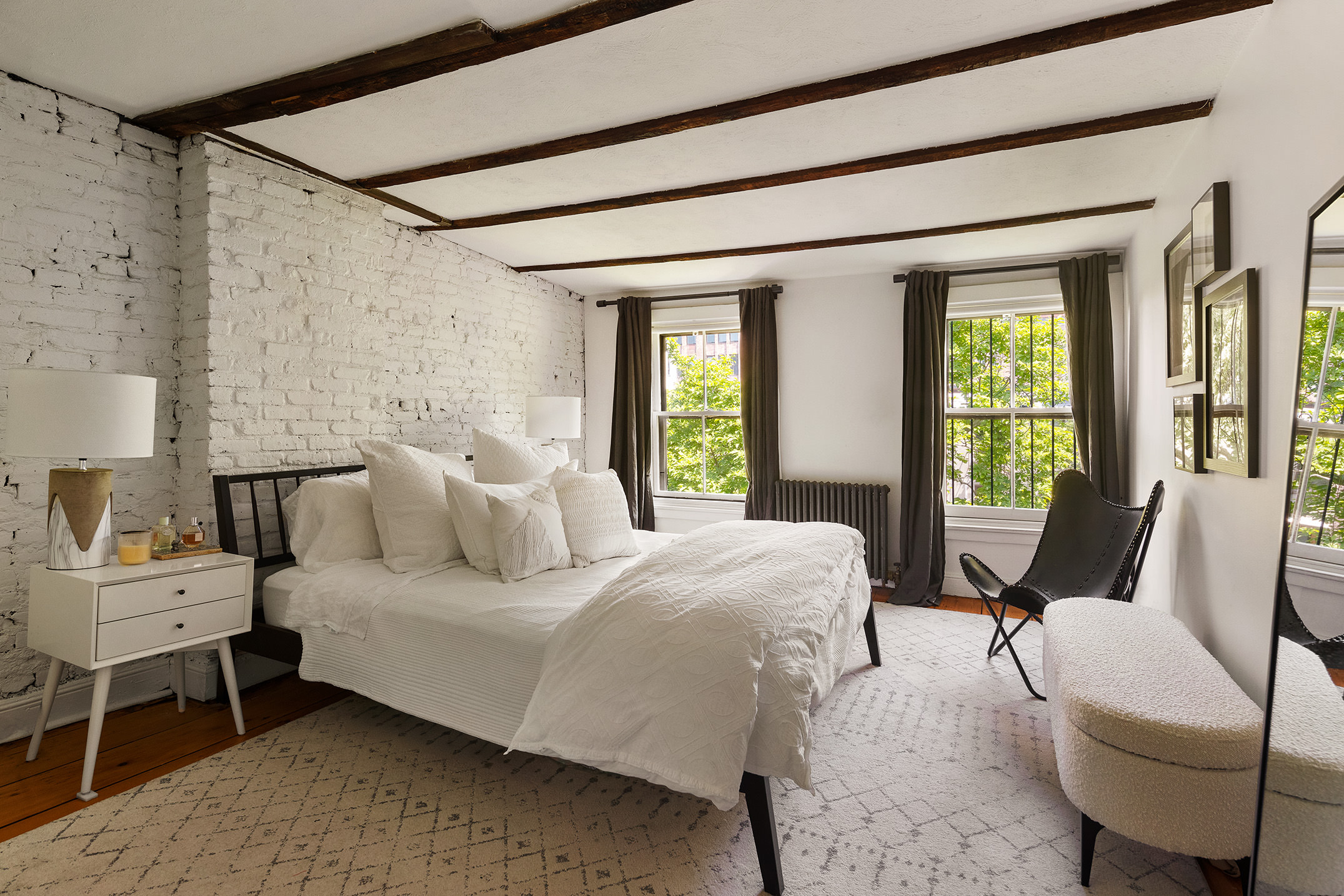 433 Pacific Street, Unit 2 Brooklyn, NY 11217 - Photo 3 of 7 a bedroom with a bed a chair and next to a window