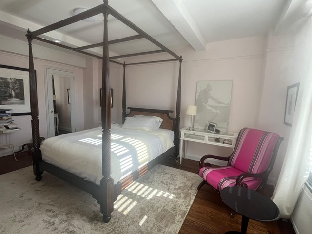 435 West 23rd Street, Unit 7B Manhattan, NY 10011 - Photo 11 of 23 a bed room with a bed and chair