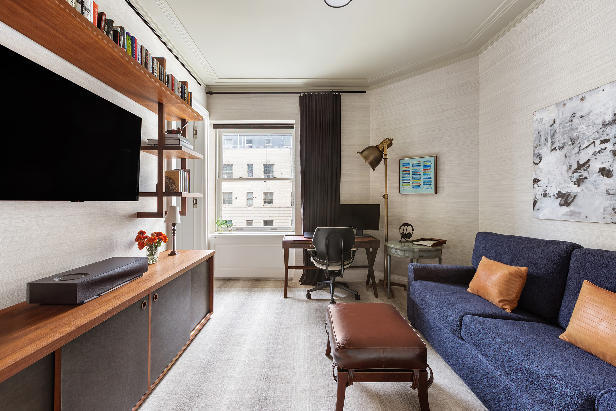 225 West 86th Street, Unit 1005 Manhattan, NY 10024 - Photo 11 of 15 a living room with furniture and a flat screen tv