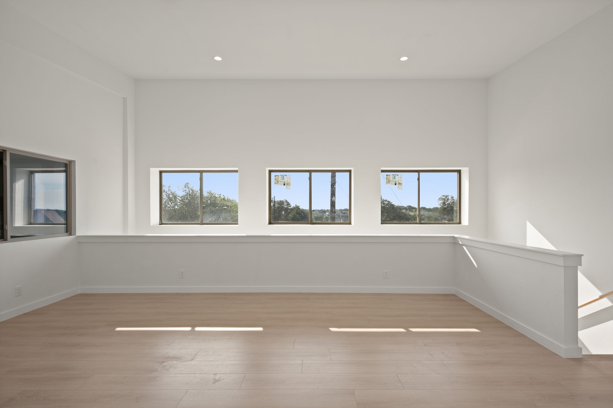 10020 Darden Hill Road, Unit 401 Austin, TX 78737 - Photo 33 of 50 an empty room with windows