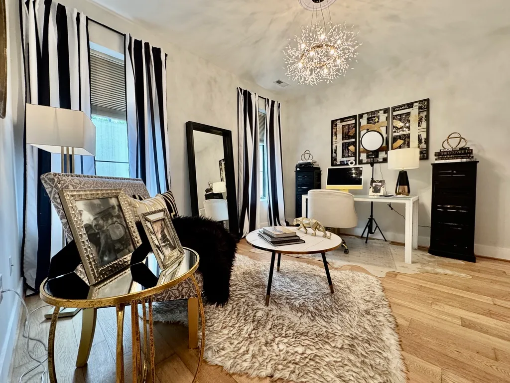 a living room with furniture and a rug