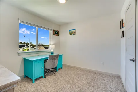 a room with furniture and a window