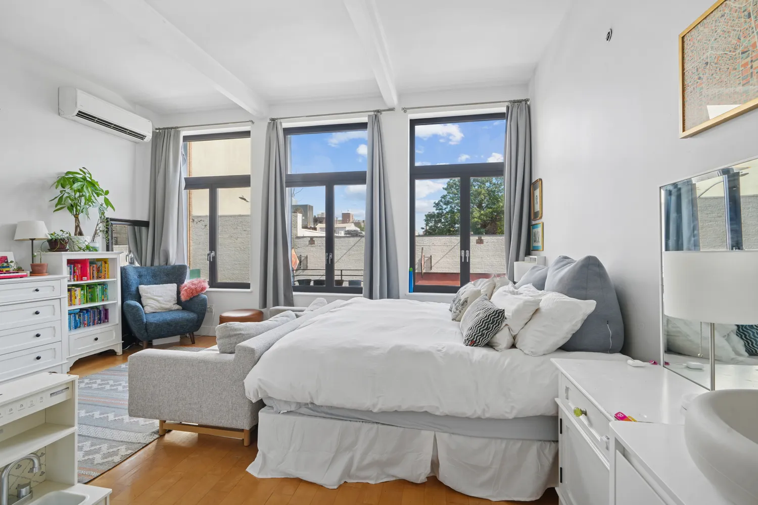 a bedroom with a bed and a couch