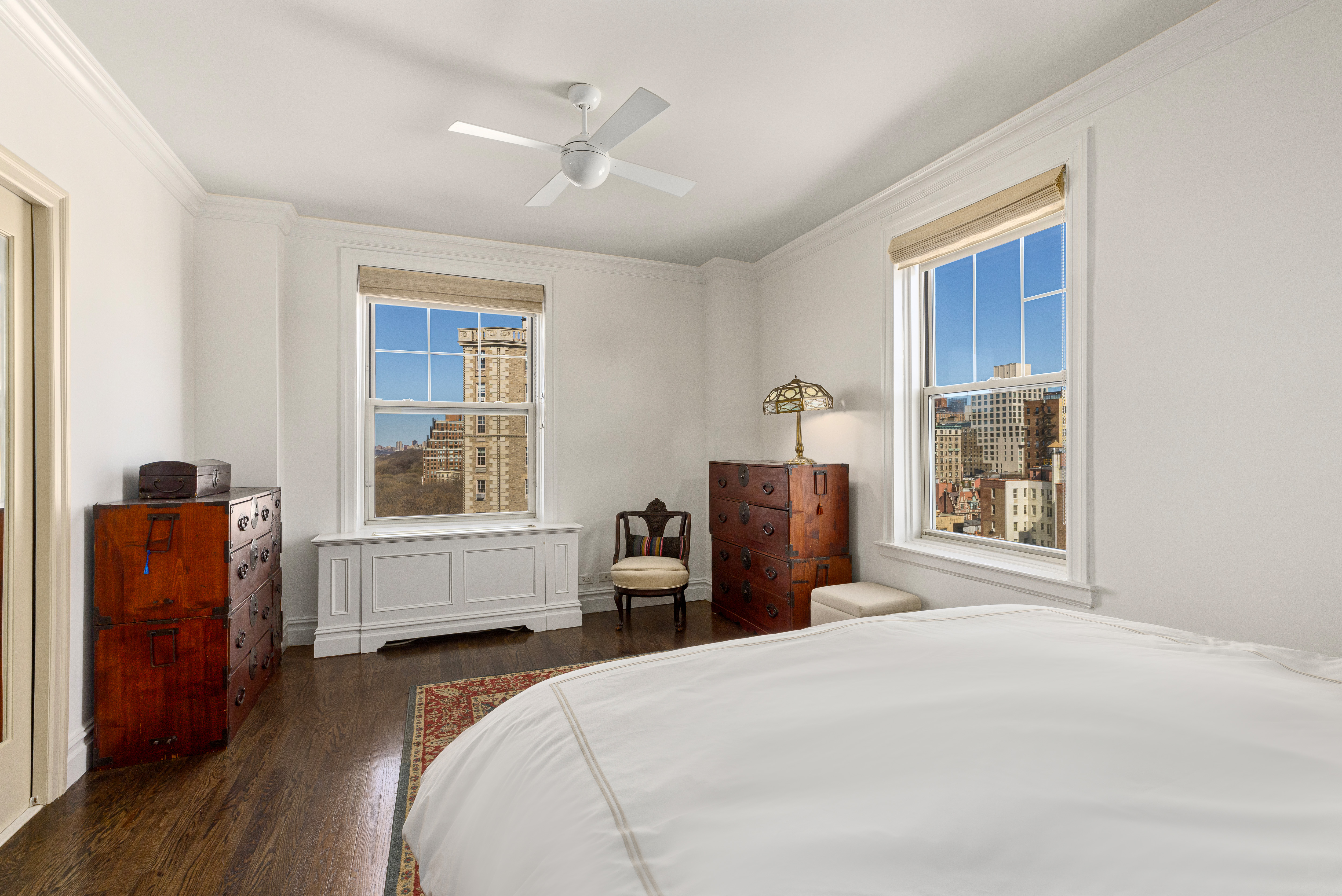 160 Riverside Drive, Unit 12D Manhattan, NY 10024 - Photo 6 of 14 a bedroom with a bed and wooden floor