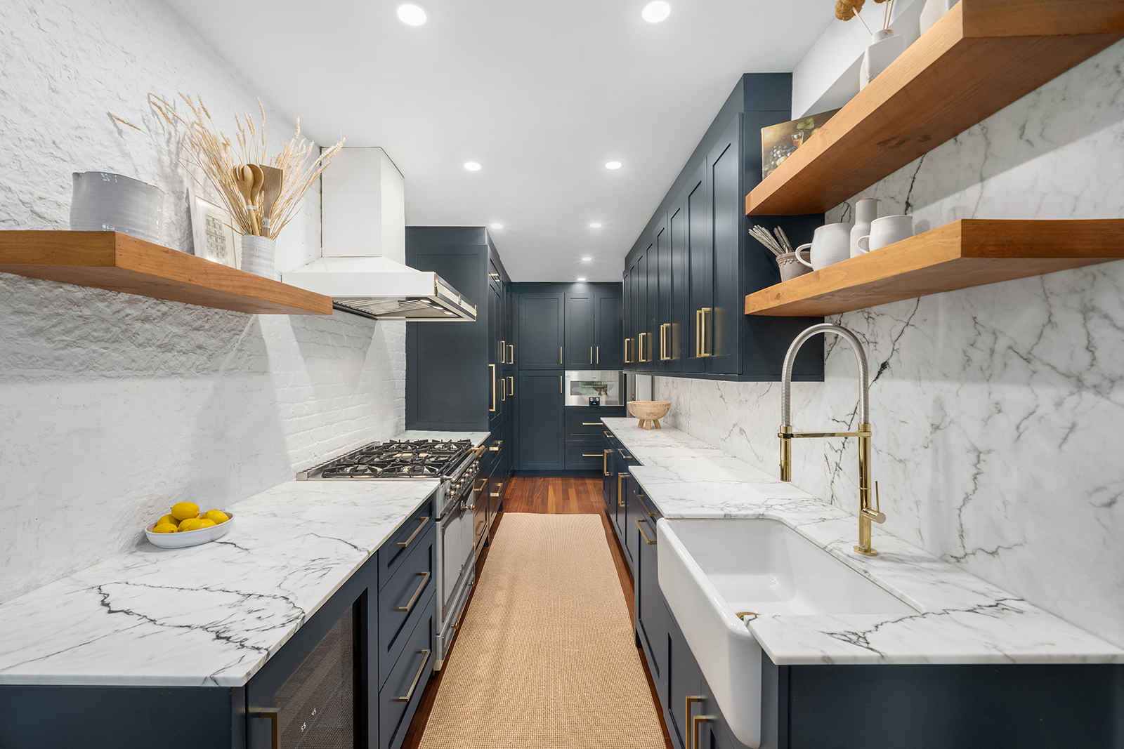 39 North Moore Street, Unit 4A Manhattan, NY 10013 - Photo 7 of 17 a view of kitchen with a sink and wooden floor