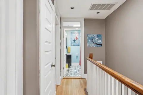 a view of a hallway with a dining area