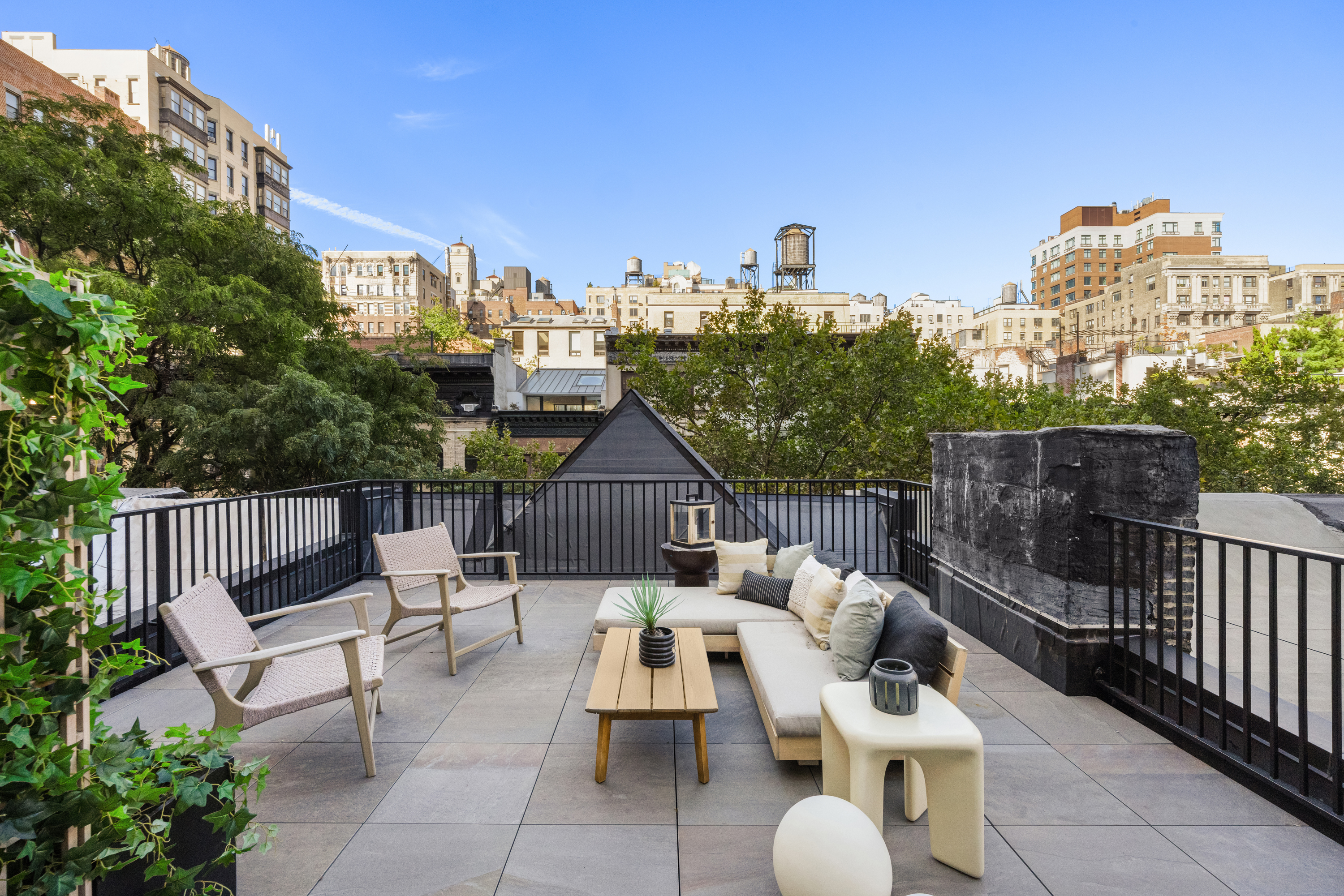 a view of a terrace with couches and pool