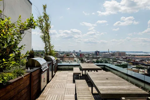 a view of a balcony with city view