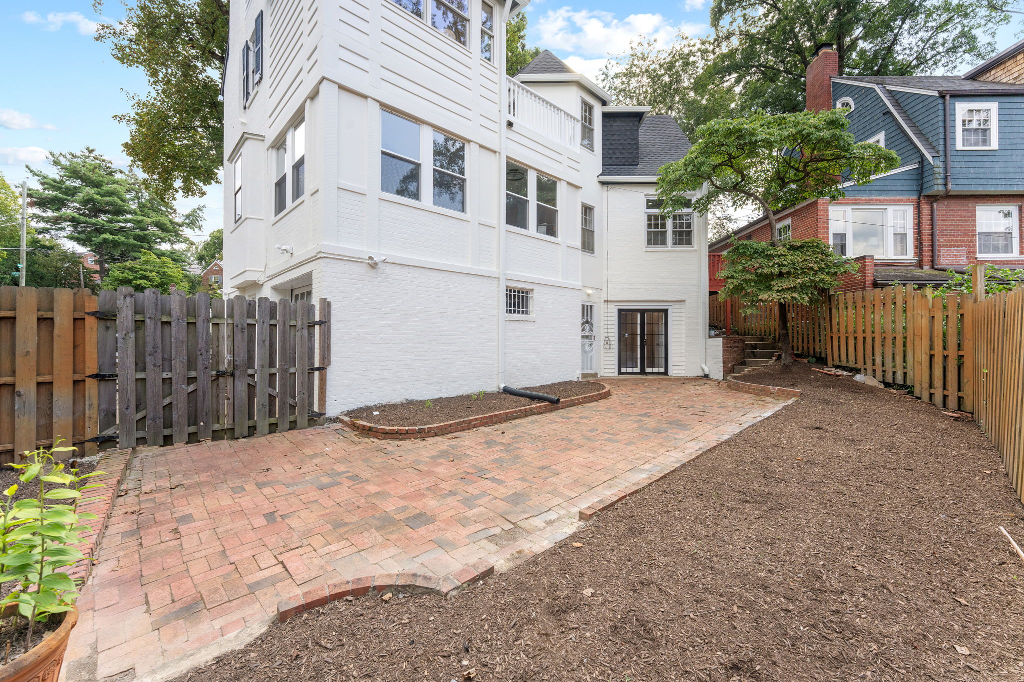 1325 Locust Road Northwest Washington, DC 20012 - Photo 51 of 56 a view of a white house with wooden fence