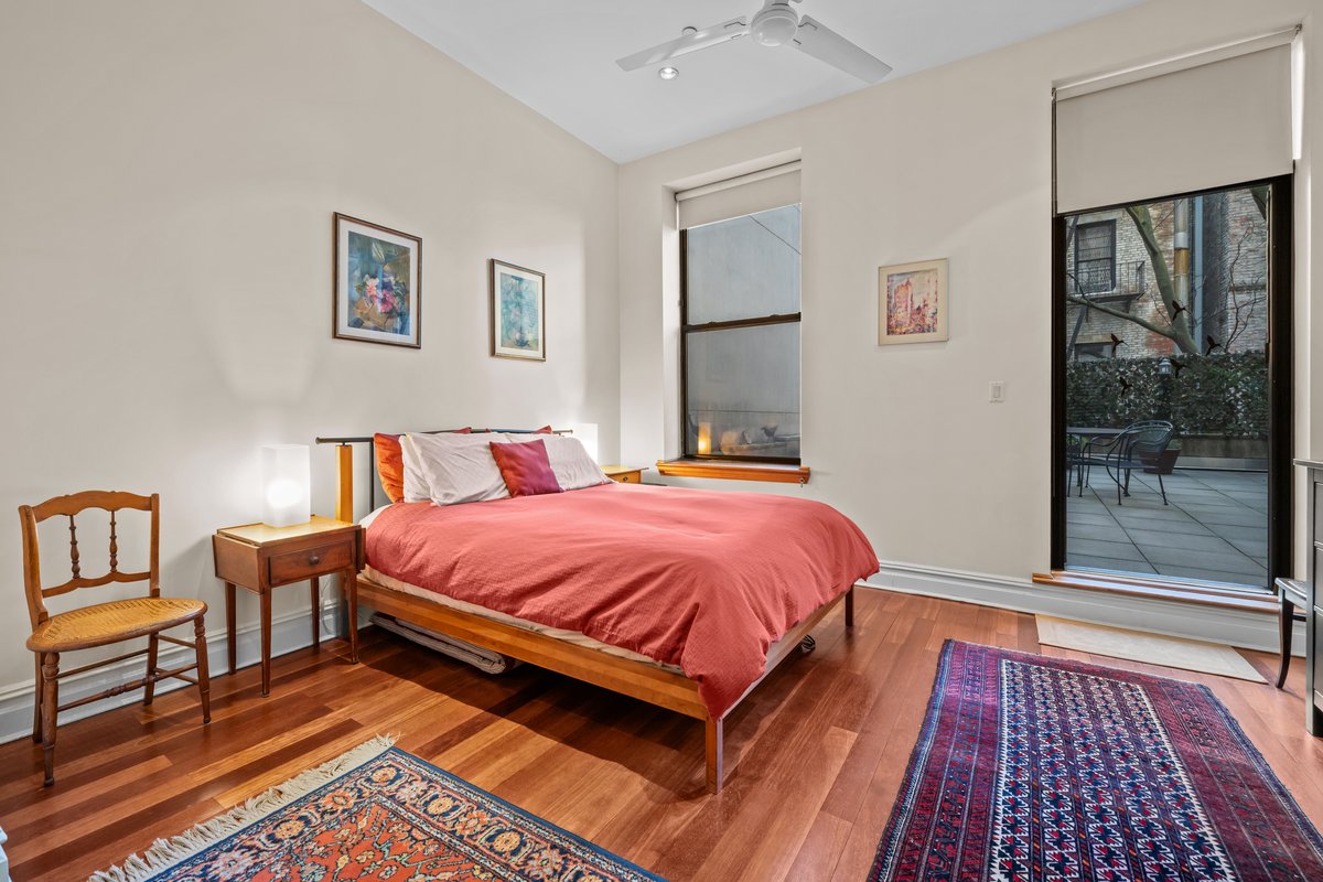 133 West 14th Street, Unit 3 Manhattan, NY 10011 - Photo 5 of 13 a bed room with a bed and a window