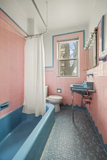 a room with wooden floor and furniture