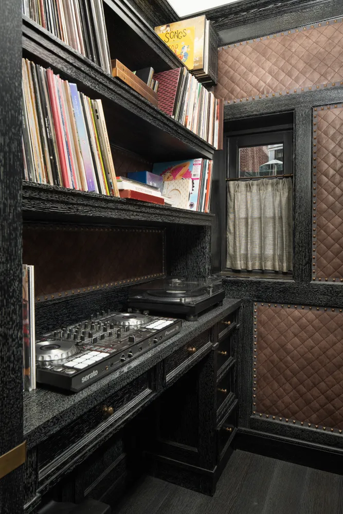 a stove top oven sitting inside of a kitchen