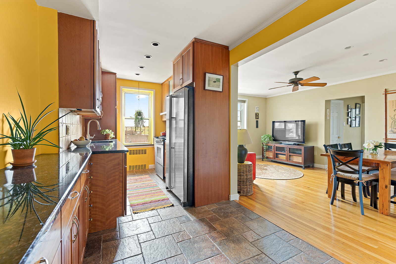 a hallway with dining table and chairs