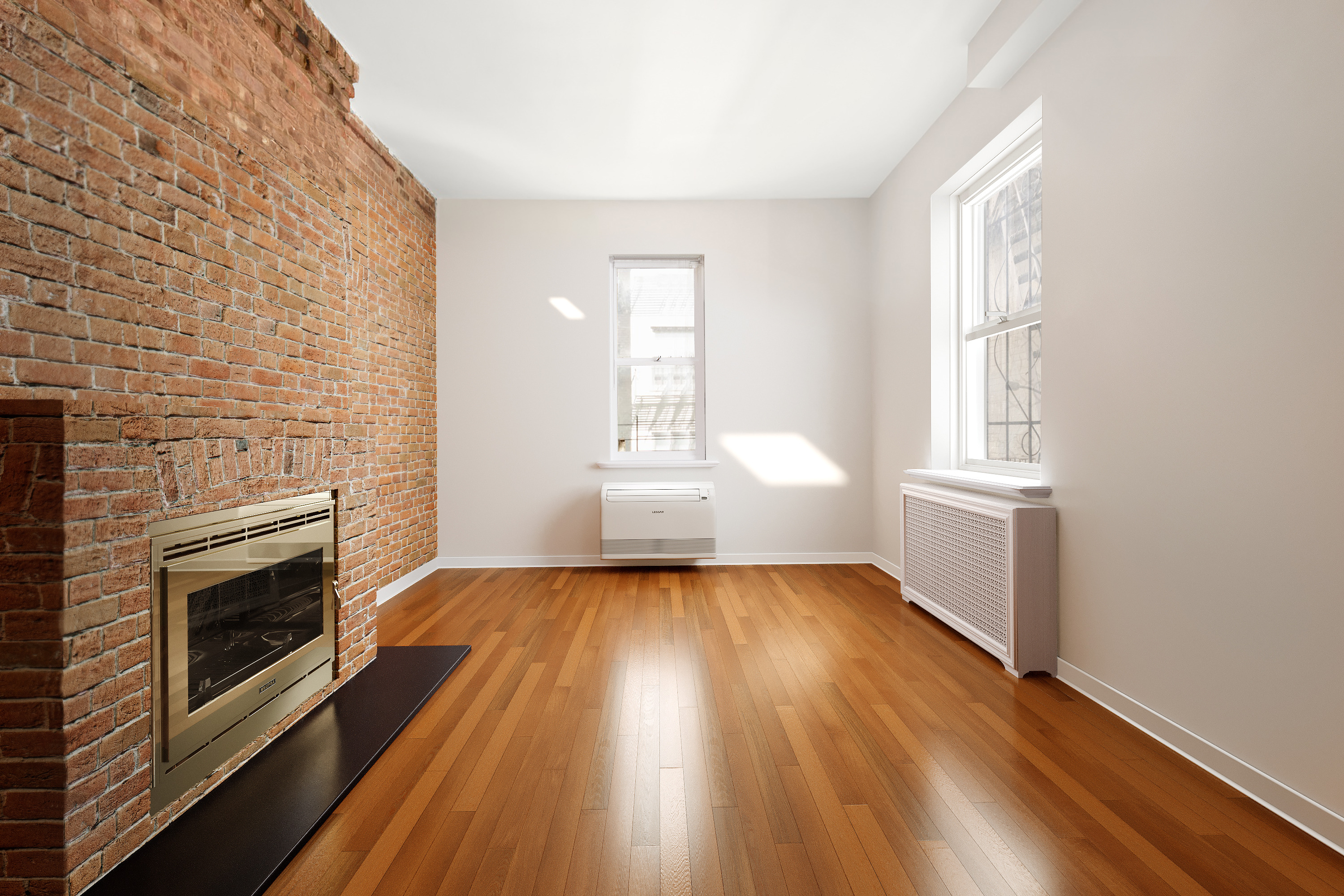 305 West 55th Street, Unit 2B Manhattan, NY 10019 - Photo 3 of 9 an empty room with wooden floor fireplace and windows