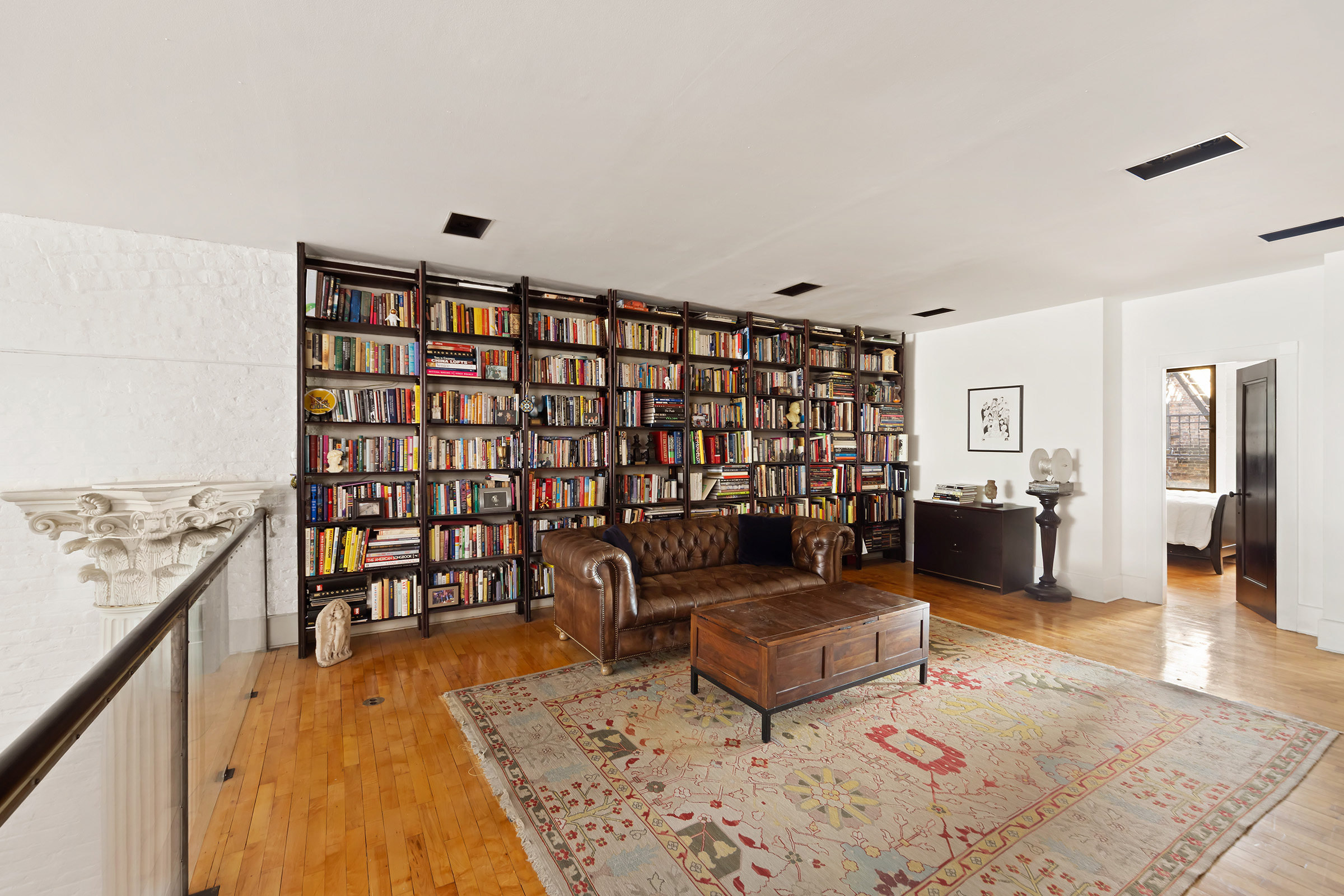 131 West 24th Street, Unit 5/6 Manhattan, NY 10011 - Photo 8 of 14 a living room with furniture and wooden floor