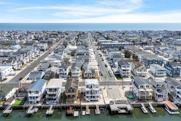 a kitchen with a sink a stove top oven and refrigerator