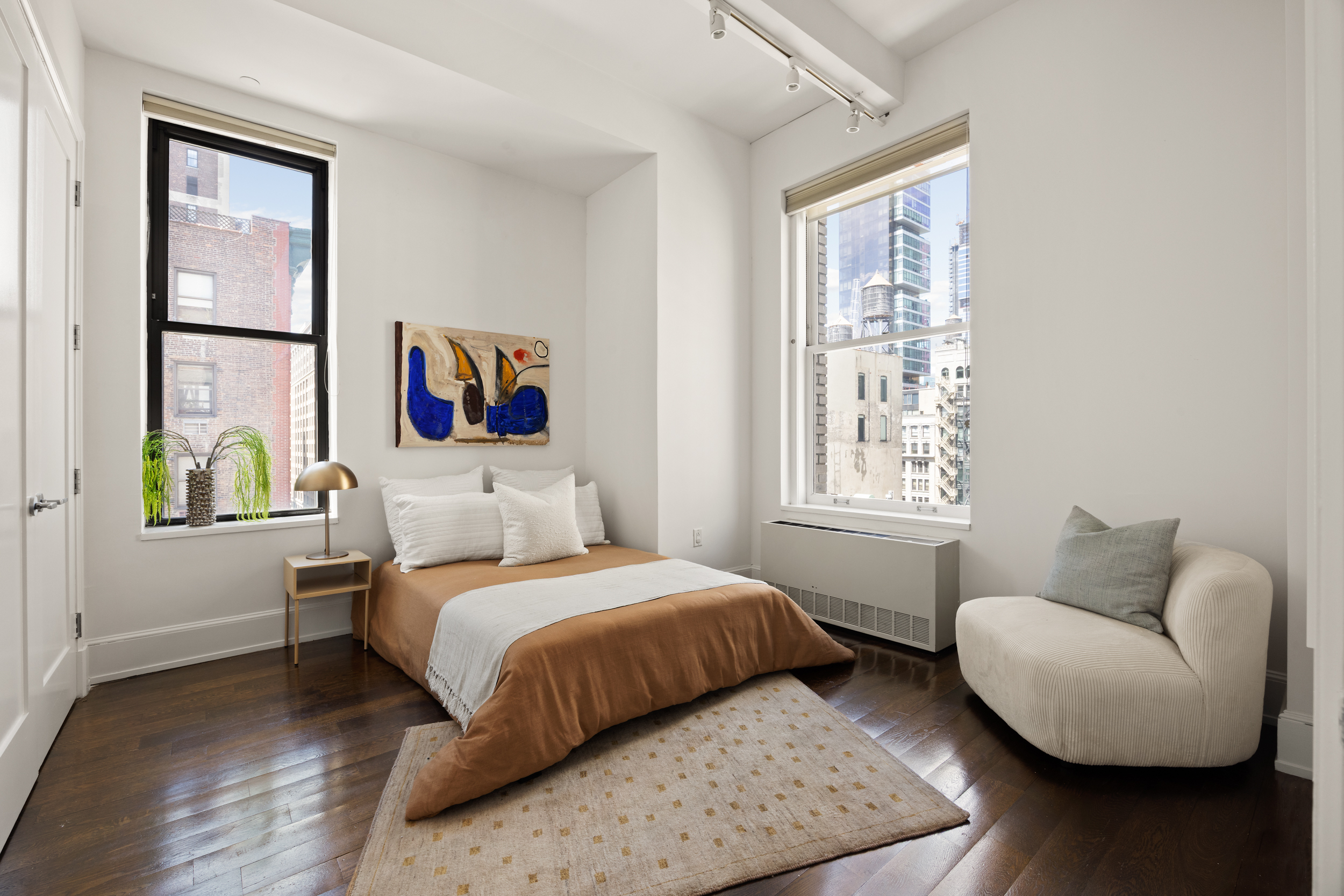 260 Park Avenue South, Unit 9G Manhattan, NY 10010 - Photo 11 of 17 a bedroom with a bed and a couch