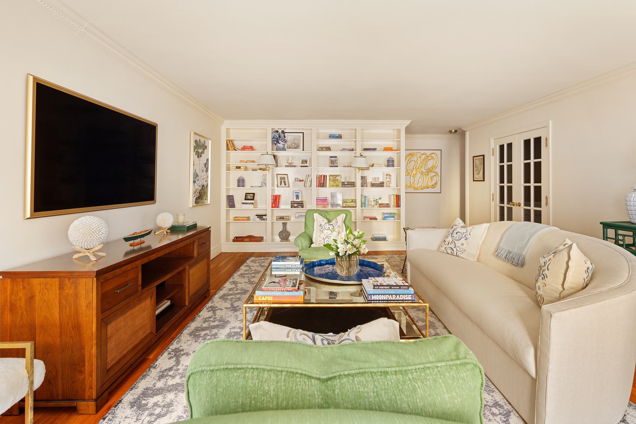 49 East 86th Street, Unit 3A Manhattan, NY 10028 - Photo 2 of 14 a living room with furniture and a flat screen tv