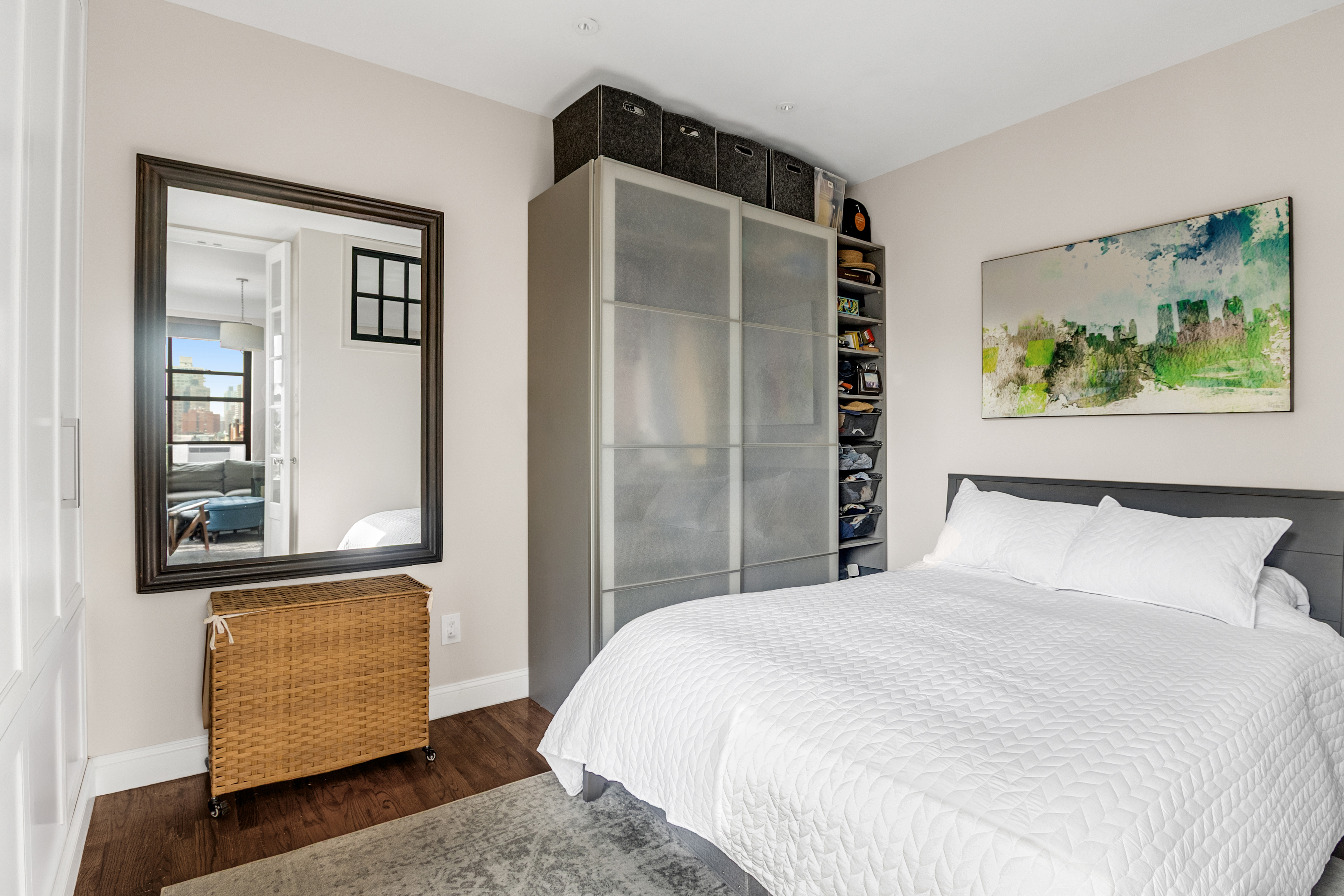 51 West 81st Street, Unit 9D Manhattan, NY 10024 - Photo 8 of 15 a bedroom with a bed and a painting on the wall