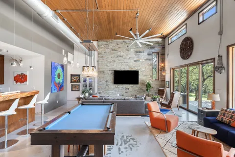 a kitchen with stainless steel appliances granite countertop a stove and a refrigerator