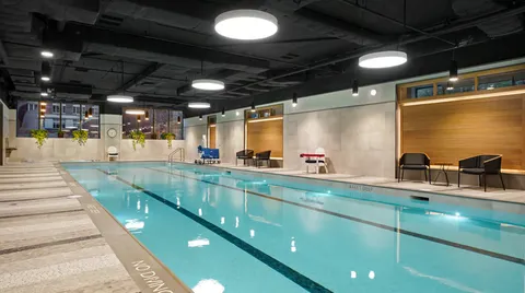 a view of a swimming pool with a patio