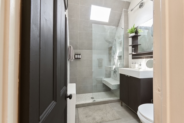 331 Highland Boulevard, Unit 2 Brooklyn, NY 11207 - Photo 6 of 6 a bathroom with a sink a toilet and shower