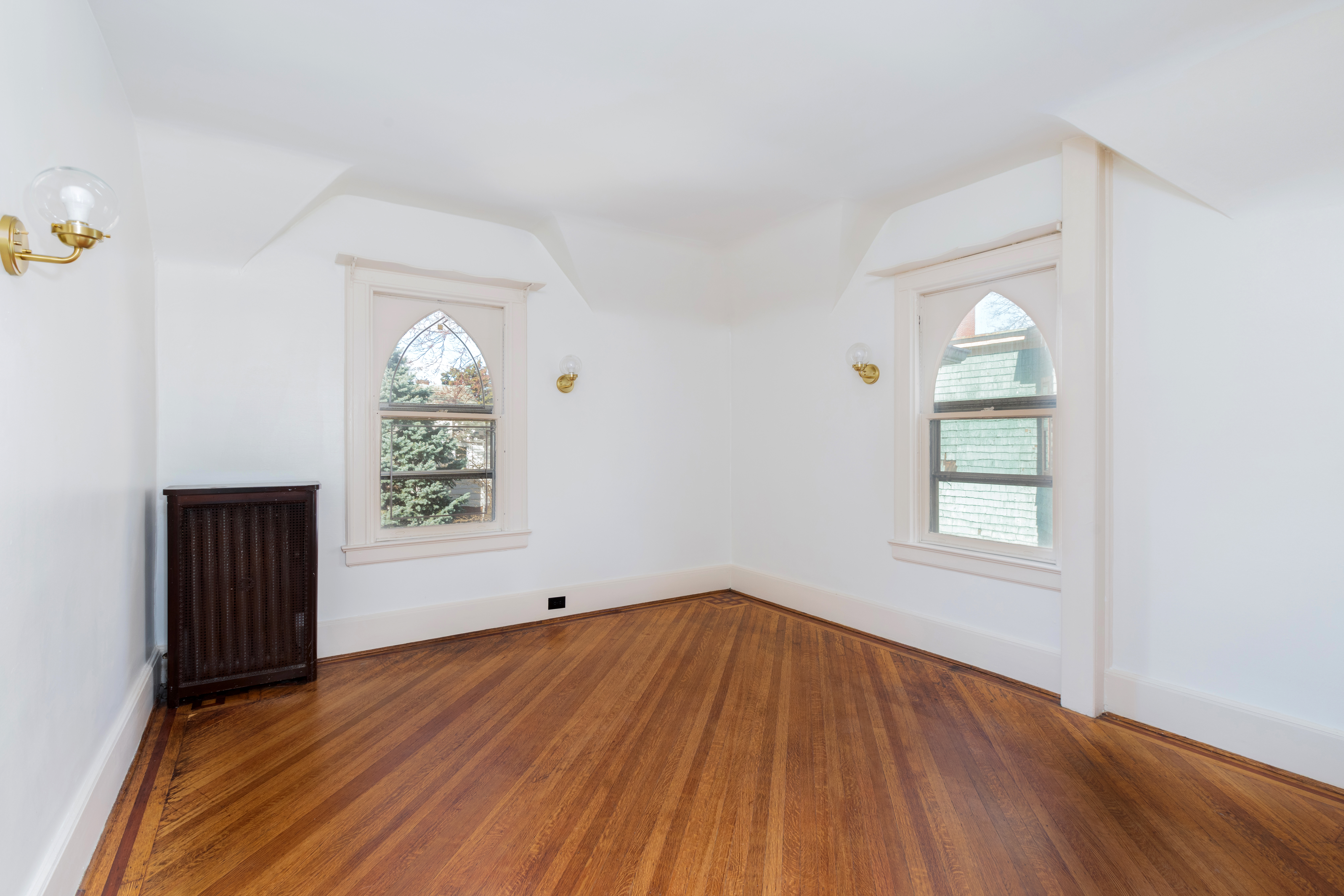 196 Marlborough Road Brooklyn, NY 11226 - Photo 17 of 23 an empty room with wooden floor and windows