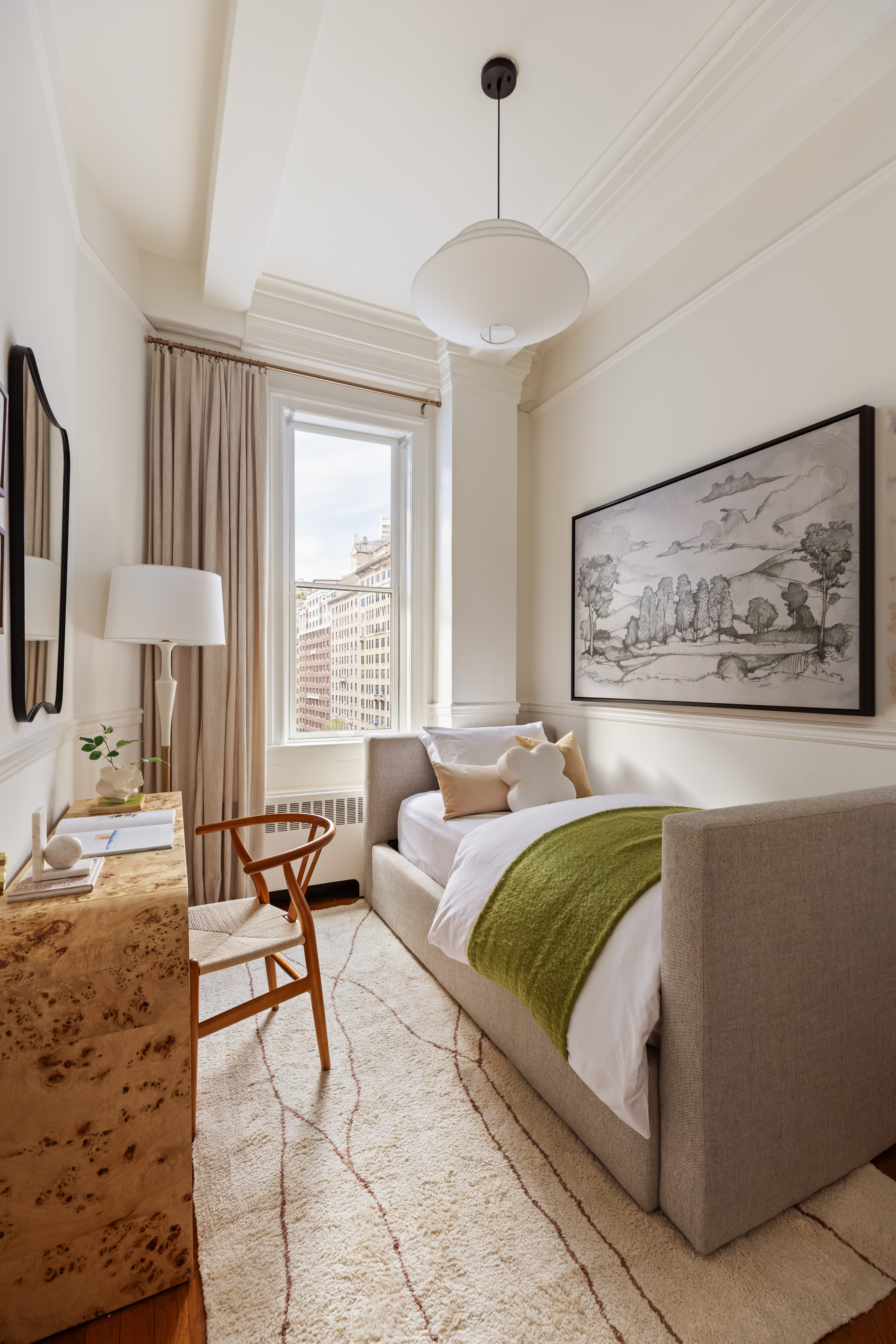 530 West End Avenue, Unit 81 Manhattan, NY 10024 - Photo 9 of 18 a living room with furniture and a large window