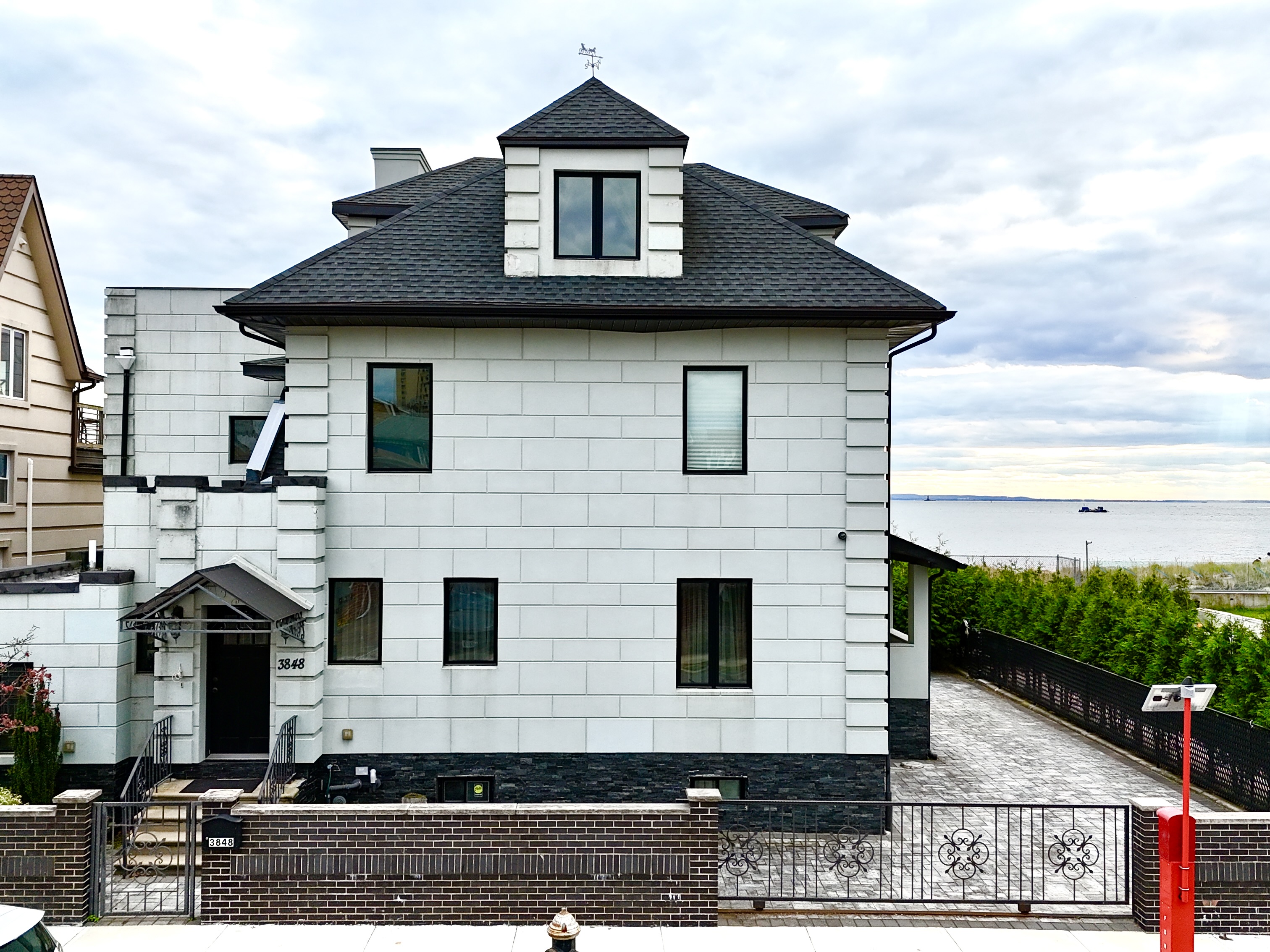 3848 Atlantic Avenue Brooklyn, NY 11224 - Photo 21 of 29 a front view of a house with a yard