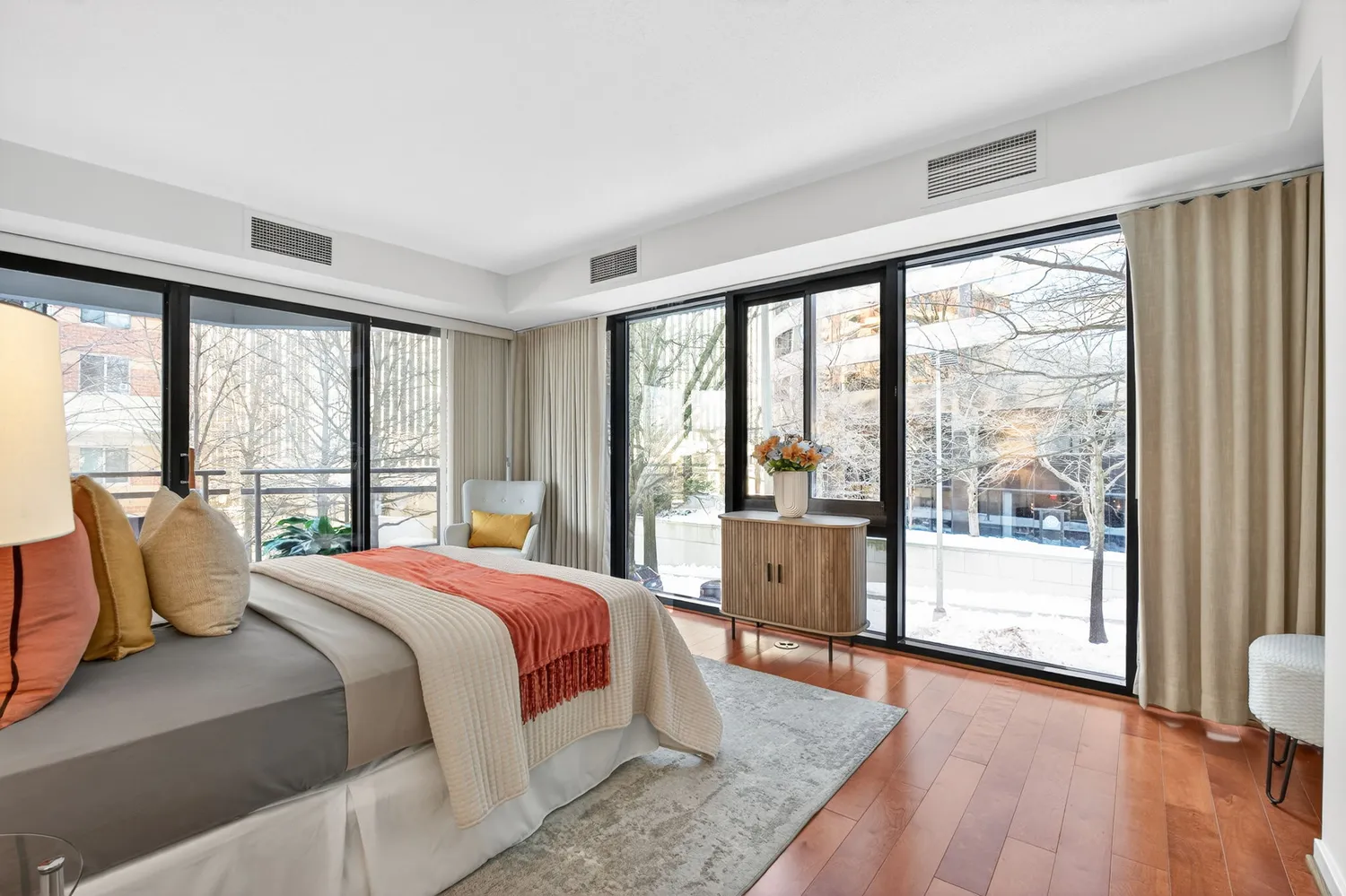 a bedroom with a large bed and a large window