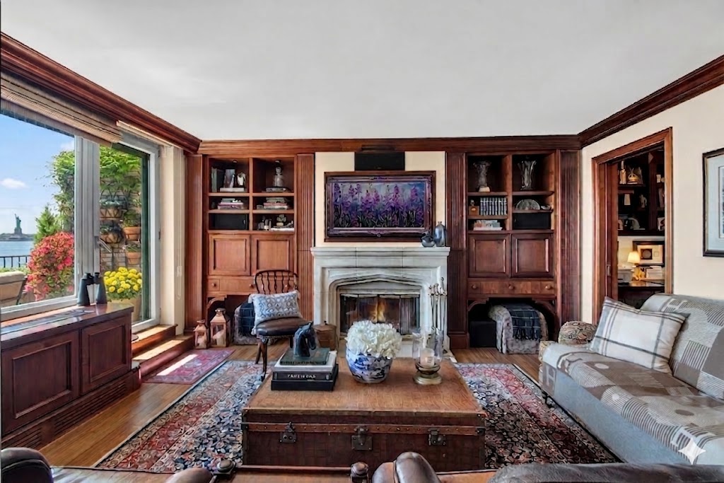 a living room with furniture fireplace and flat screen tv