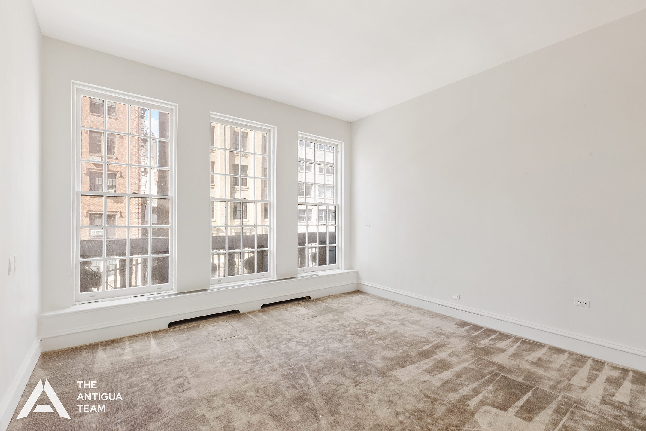45 East 66th Street, Unit 4W Manhattan, NY 10065 - Photo 18 of 27 a view of an empty room with a window