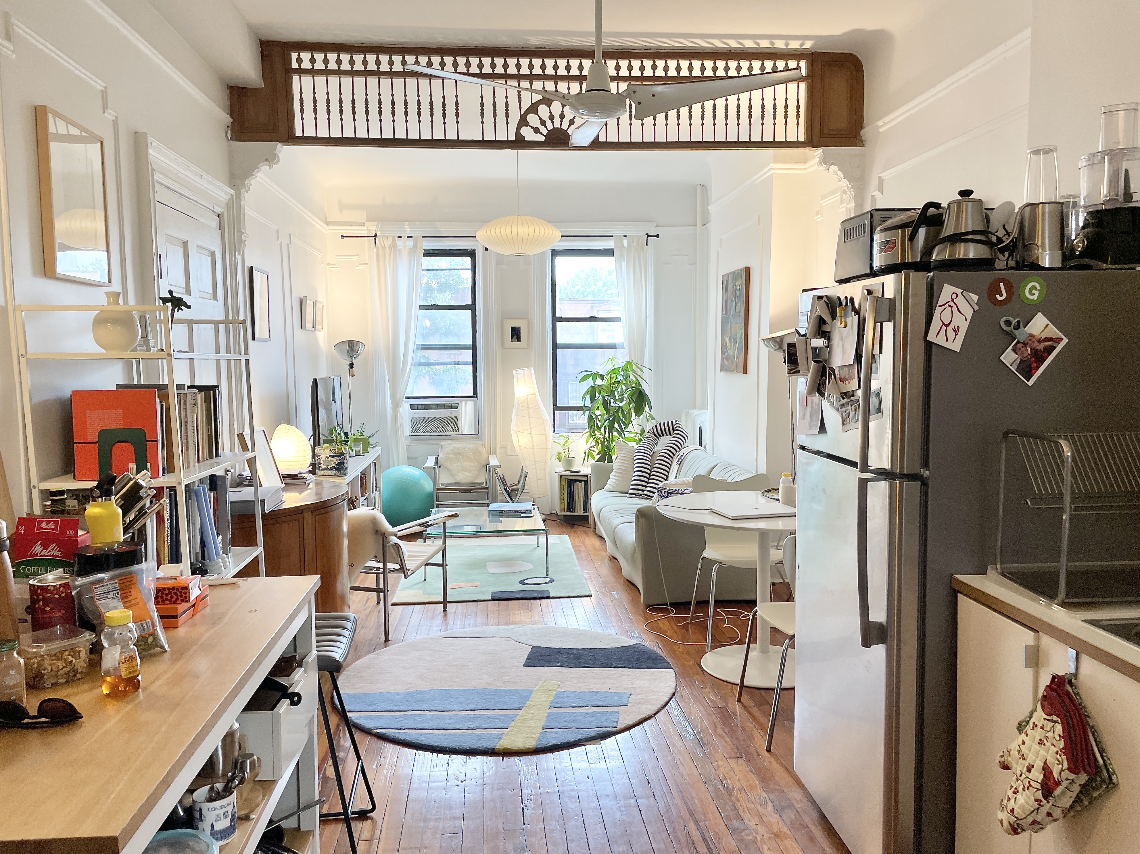 447 Jefferson Avenue, Unit 3L Brooklyn, NY 11221 - Photo 2 of 13 a living room with furniture a wooden floor and a fireplace