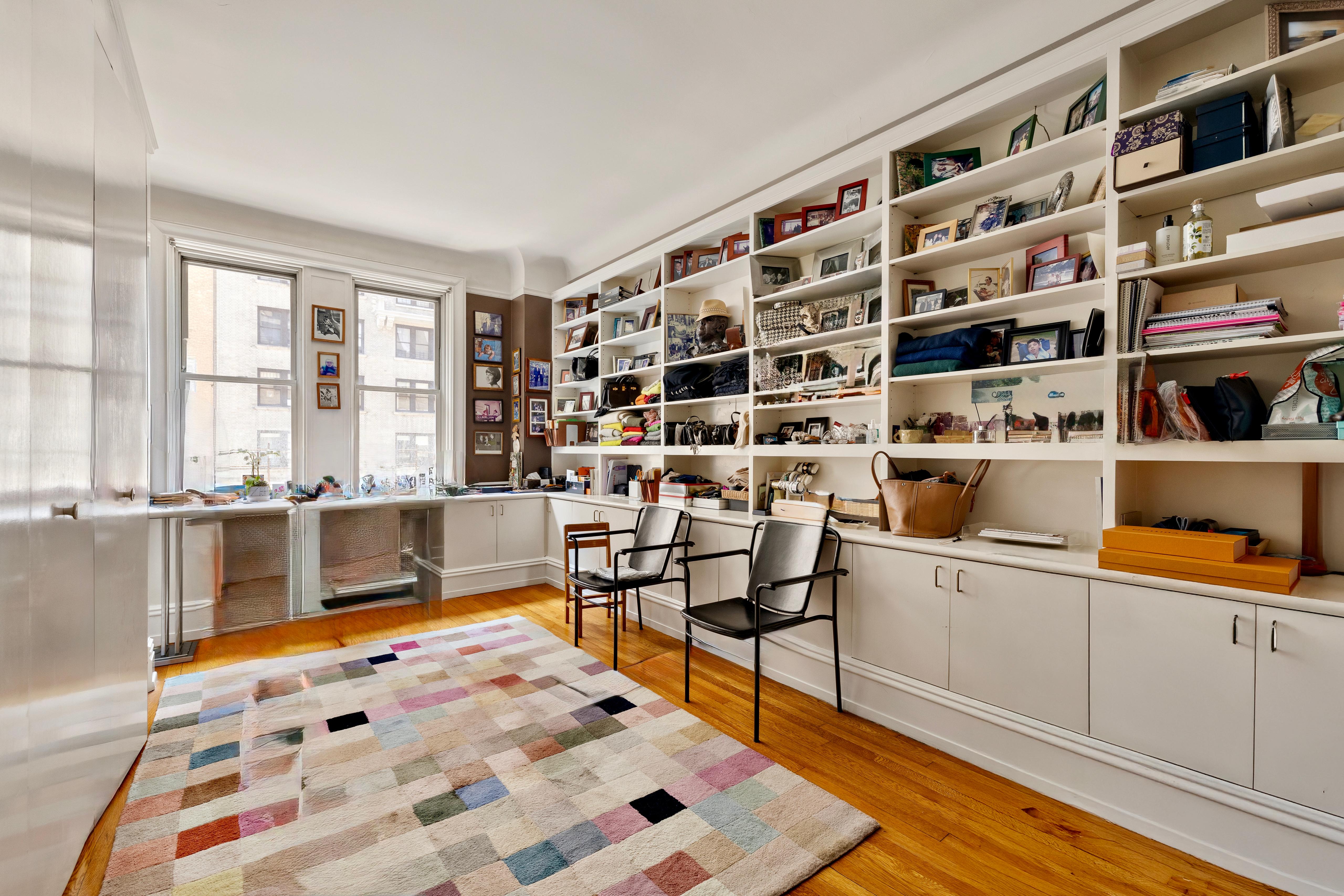 151 West 86th Street, Unit 4D Manhattan, NY 10024 - Photo 14 of 15 a bedroom with furniture and a book shelf